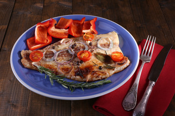Dish of Pangasius fillet with spices and vegetables