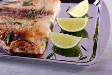 Dish of Pangasius fillet with rosemary and lime