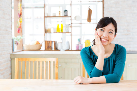 young asian woman in the kitchen