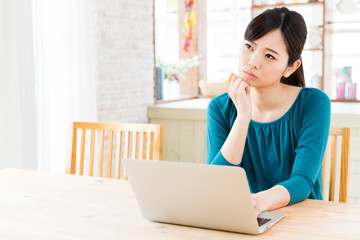 young asian woman in the kitchen