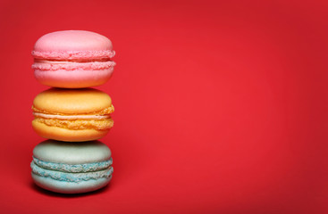 Colorful macaroon over red background
