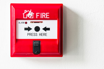 fire alarm box on cement wall