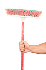 closeup of hand holding a broom