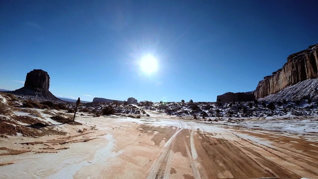 POV winter landscape snow sky sun flare Plateau Monument Valley Arizona USA