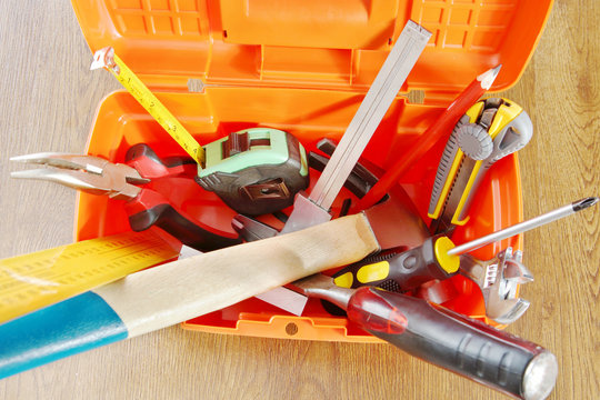 Plastic toolbox with various working tools. View from above