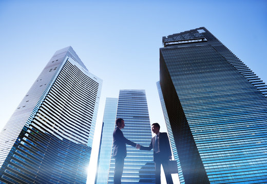 Businessmen Cityscape Handshake Partnership Concept