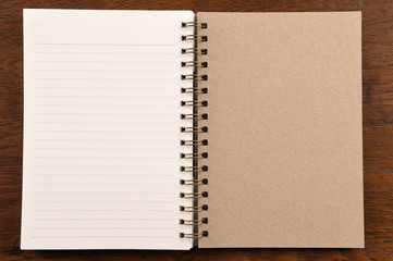 Open notebook on wooden background