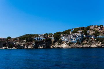 Fototapeta na wymiar Apartment buildings by Mediterranean Sea. view of Mallorca coas