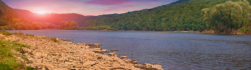 Colorful summer sunrise on the mountain river