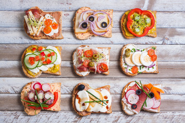 Sandwiches on wooden background, top view - 76962420