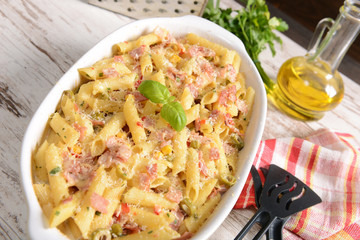 Penne pasta casserole with cheese, ham and corn