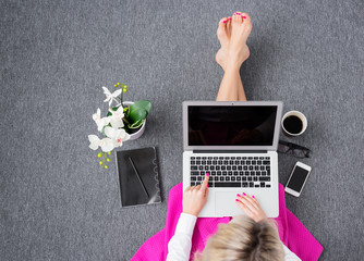 Woman working with computer, view from above