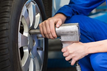 Mechanic adjusting the tire wheel