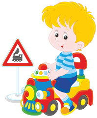 Boy on a toy train