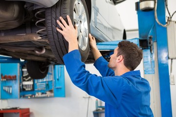 Mechanic adjusting the tire wheel