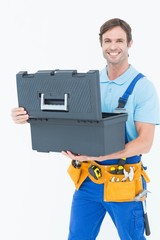 Confident carpenter opening tool box
