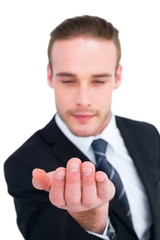 Cheerful businessman holding out his hand