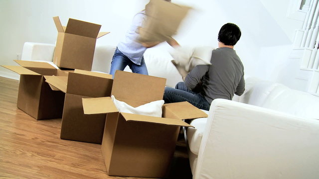 Young Ethnic Couple Having Fun After Home Move 