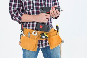 Handyman holding drill machine