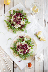 Tacos with arugula, quinoa and black beans
