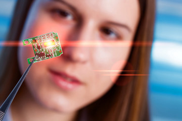Girl shows new microchip that can be implanted into a paralyzed