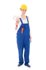 young beautiful woman painter in blue coveralls and yellow helme