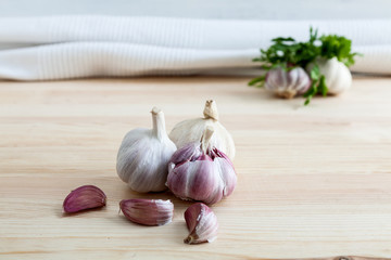 Composition of purple garlic with parsley