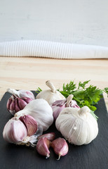 Composition of purple garlic with parsley