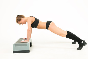sport girl push-ups of step