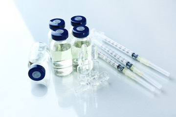 Vaccine in vial with syringe