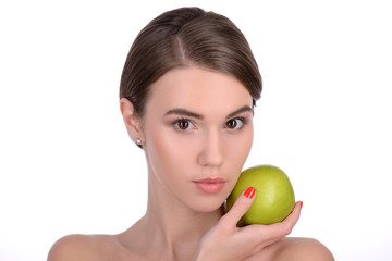 Attractive young woman with green apple