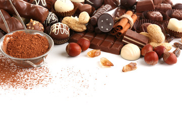 Delicious chocolate candies on white background