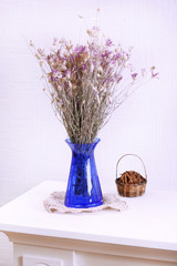 Composition of dried flowers on white wall background