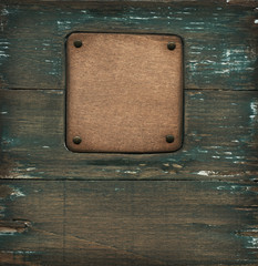 Old wooden label on background