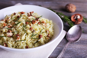 Rice with walnuts and rosemary in plate
