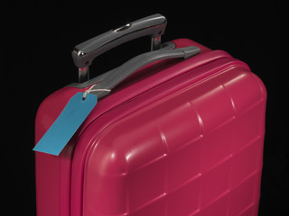 pink suitcase and blue tag