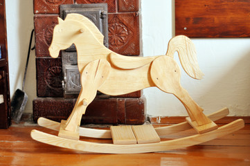 A beautiful handmade wooden horse in a vintage room