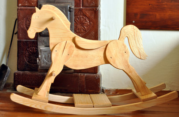 A beautiful handmade wooden horse in a vintage room
