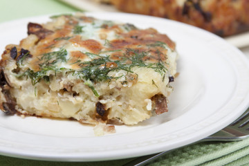 Vegetable casserole   of potatoes with dried porcini mushrooms a