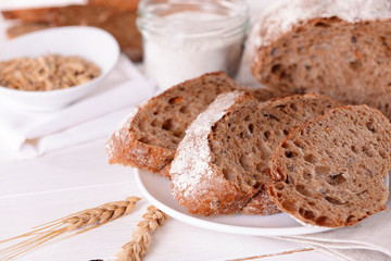 Tasty bread on table on light background
