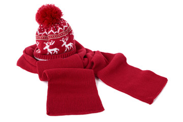Red bobble ski knit hat and scarf isolated white background photo