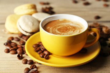 Gentle colorful macaroons and  coffee in mug