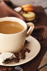Gentle colorful macaroons and  coffee in mug