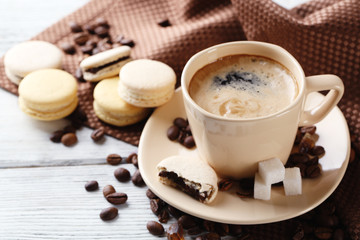 Gentle colorful macaroons and  coffee in mug