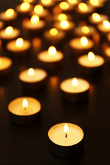Fototapeta na wymiar Burning candles on dark background