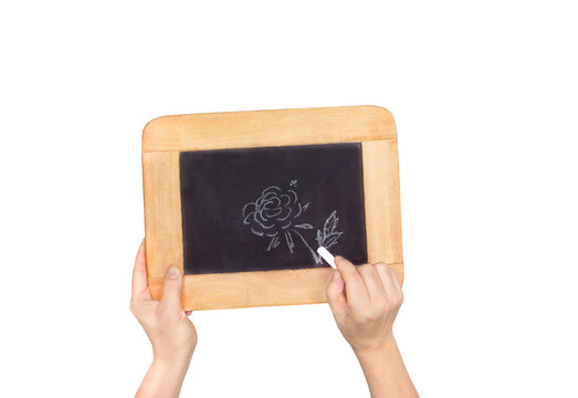 hands holding slate with photo of flower isolated on white backg