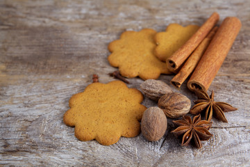 Biscuit with spices on wooden background
