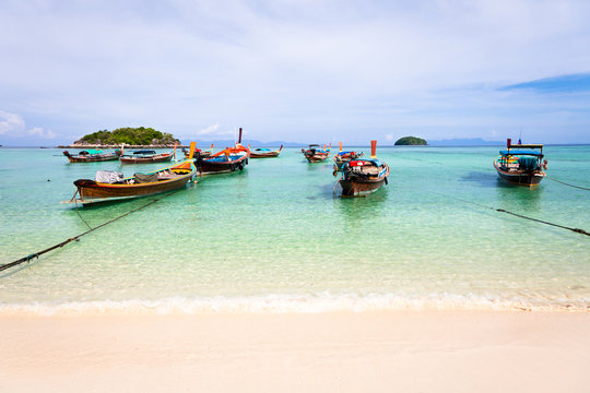 Traditional thai boats on the beach, Thailand
