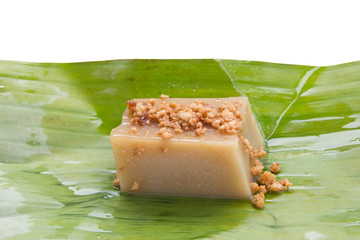 Thailand dessert wrapped in banana leaves isolated on white back