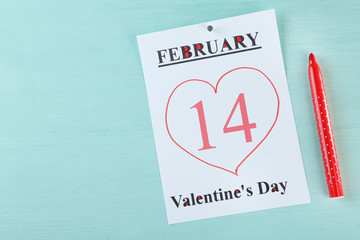 Valentines Day, February 14 on calendar on wooden background